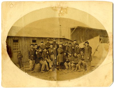 Oval photograph of Union officer (probably Alba M. Tucker) surrounded by his staff in Louisville, Ky. by American Photographer